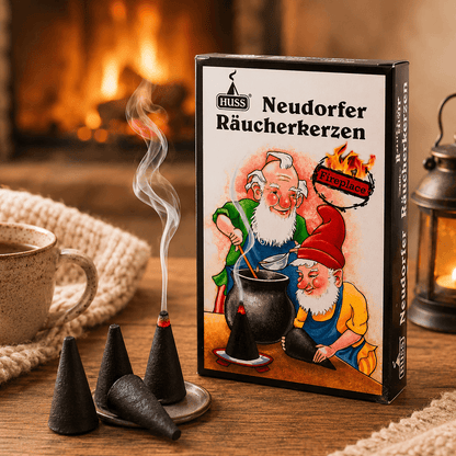 A box of HUSS Incense cones Fireplace, styled on a wooden table with incense cones smoking, and a fireplace in the background.