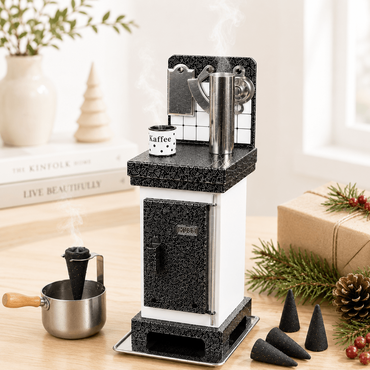 HUSS Incense incense cone oven in white and silver with rising steam, displayed on a wooden table with Christmas decor.
