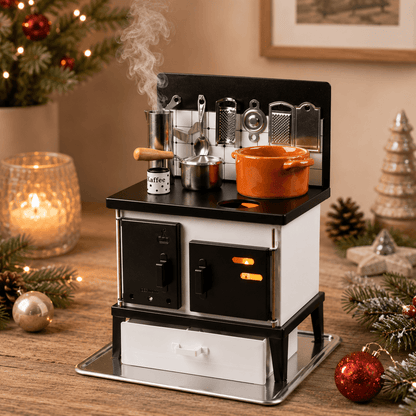 HUSS black-and-white multi-purpose incense oven with miniature cookware and a steaming coffee pot, displayed on a wooden table with subtle holiday décor.