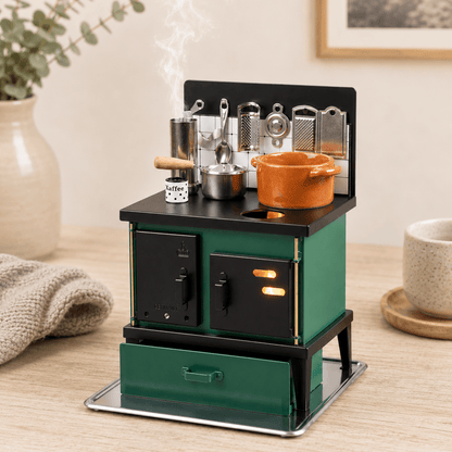 HUSS Incense green and black multi-purpose oven with miniature cookware, kitchen utensils, and rising steam on a wooden table.