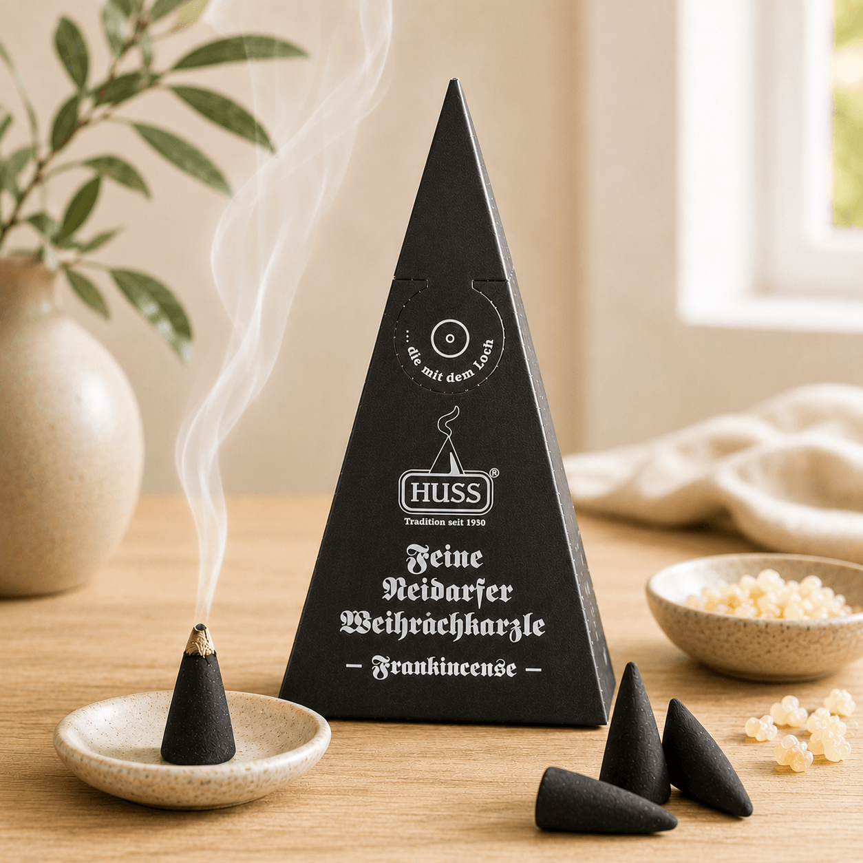 Fine Neudorf Incense cone box frankincense with a smoking cone in a cozy setting.