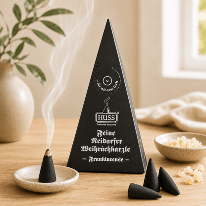 Fine Neudorf Incense cone box frankincense with a smoking cone in a cozy setting.