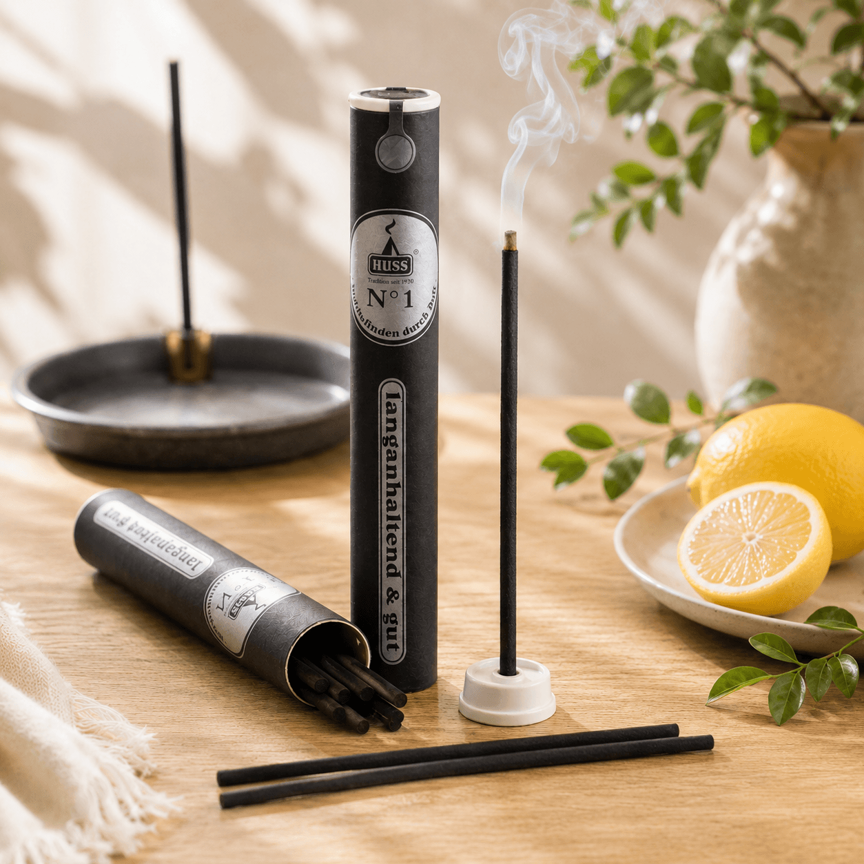 HUSS No. 1 Citrus incense sticks with holder and tube packaging, featuring a burning incense stick releasing gentle smoke beside fresh lemons in a bright summer-inspired setting.