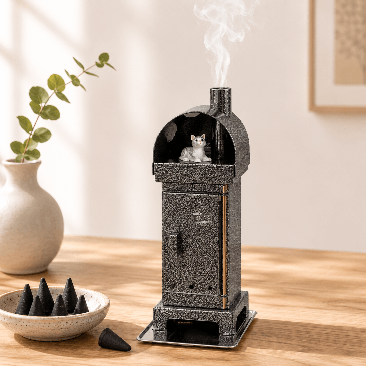 Copper HUSS Incense woodburner silver with a cat steaming out of the chimney in a cozy living room scene.